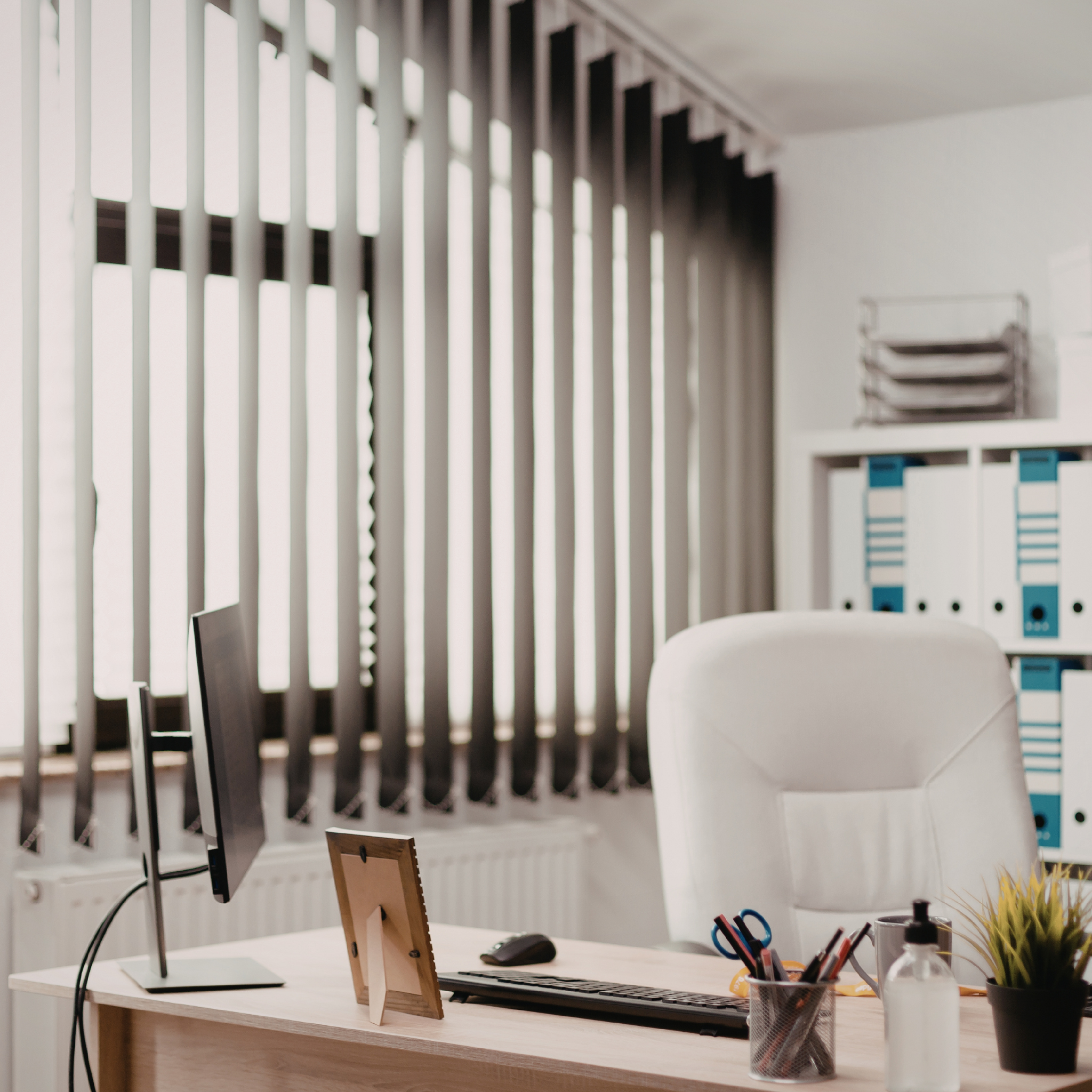 Vertical blinds in living space providing light control and easy operation