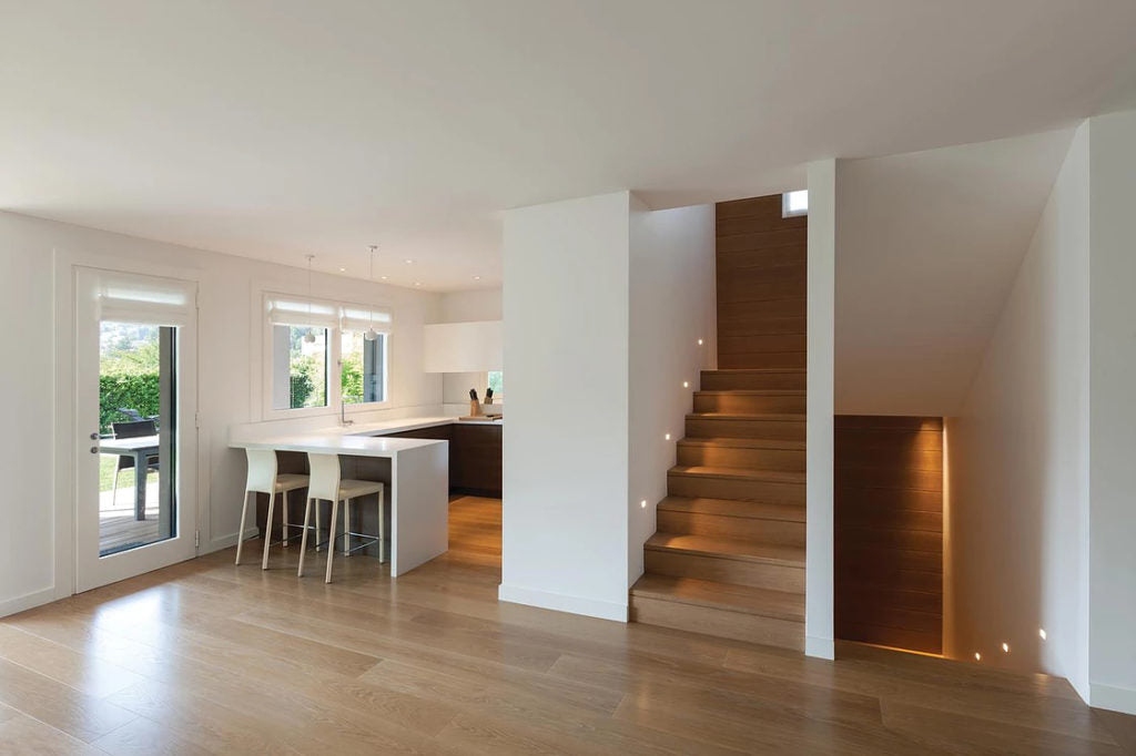 Natural oak timber plank flooring in bright living room with modern finishes